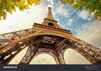 stock-photo-a-view-of-the-eiffel-tower-from-below-with-eiffel-tower-in-the-background-2456579377.jpg