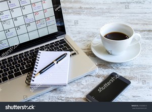stock-photo-checking-monthly-activities-and-appointments-at-the-office-in-the-laptop-215559013.jpg