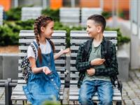 Shutterstock_1437397169_two kids talking_divi bērni runā.jpg