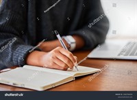 stock-photo-notebook-writing-and-hand-in-home-for-entrepreneurship-small-business-and-research-with-laptop-2465784505.jpg