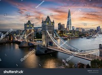 stock-photo-aerial-view-to-the-illuminated-tower-bridge-and-skyline-of-london-uk-just-after-sunset-1408766060.jpg
