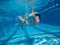 Shutterstock_2301958621_baby with mother swimming_zīdainis peld ar mammu.jpg