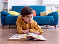 shutterstock_2458895535_child reading_bērns lasa.jpg