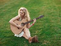 Shutterstock_558327757_girl plays guitar_meitene spēlē ģitāru.jpg
