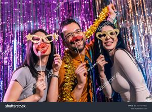 stock-photo-three-friends-celebrating-new-years-eve-at-the-night-club-they-put-on-funny-goggles-and-mustache-2527377951.jpg